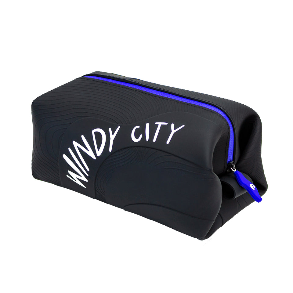 3/4 view of black silicone pouch with 3D wave texture, Windy City in white capitals on long side, blue plastic zipper