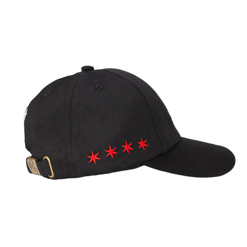 Right side of black cotton-nylon baseball cap, horizontal line of 4 red embroidered 6-point stars, rear bronze hinge