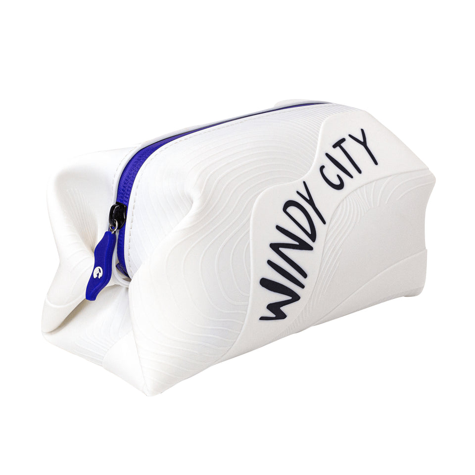 3/4 view of white silicone pouch with 3D wave texture, Windy City in black capitals on long side, blue plastic zipper