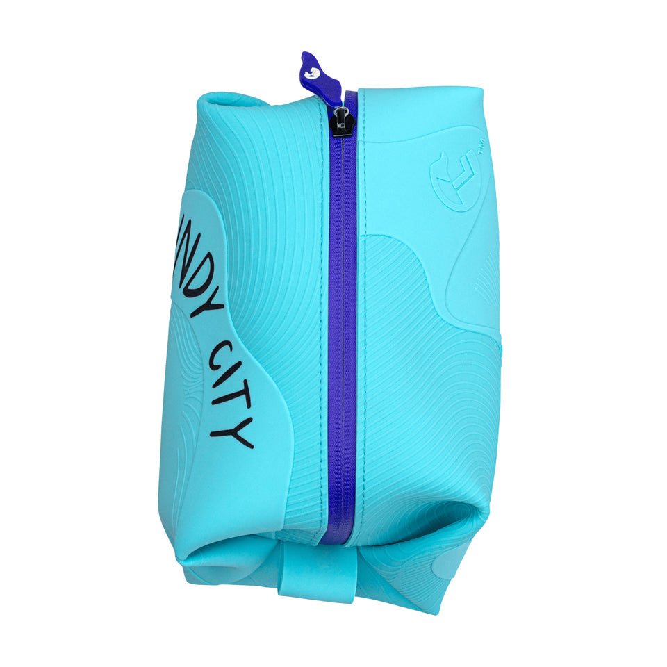 Pouch from above: 3D aqua silicone waves, blue plastic zipper, blue silicone pull, small aqua silicone loop on short side