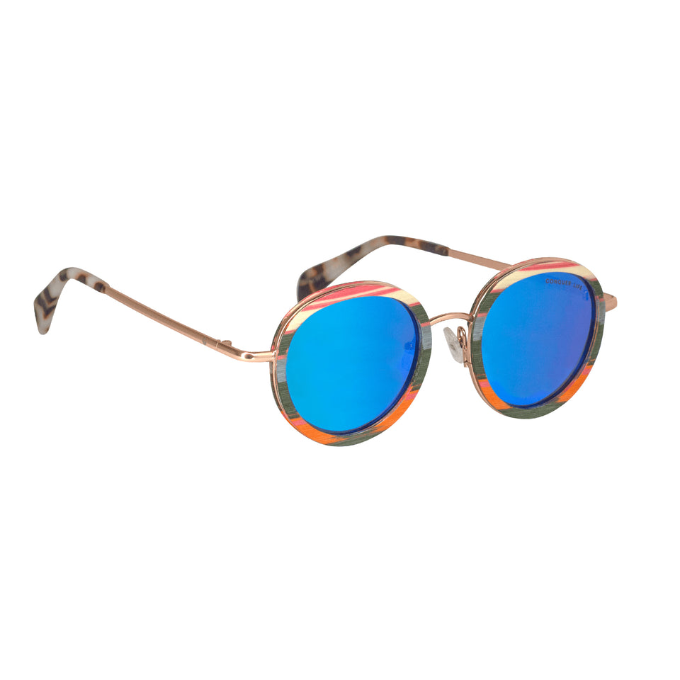 3/4 front multicolor wood sunglasses: rose gold metal arms, white tortoiseshell acetate tips, mirror lenses