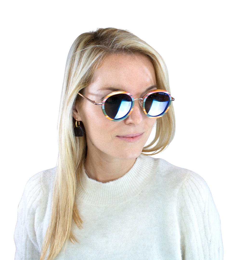 Closeup of female model in multicolor wood sunglasses with polarized mirror lenses